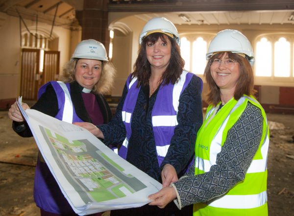 Bronwen Rapely, Deputy Mayor Cllr Ann O'Byrne and Rev’d Dr Shannon Ledbetter look at plans for the new Kingsley Road development in Toxteth, Liverpool